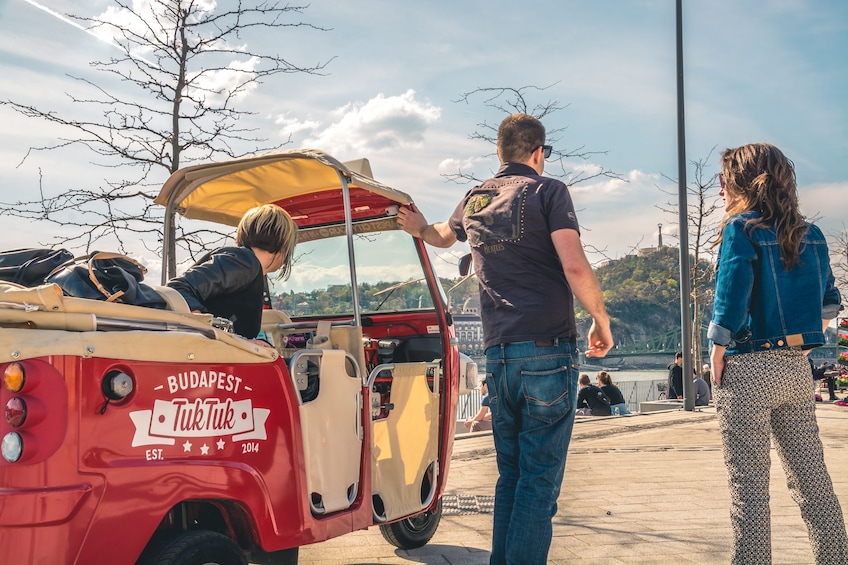 Group with a Tuk Tuk vehicle in Budapest