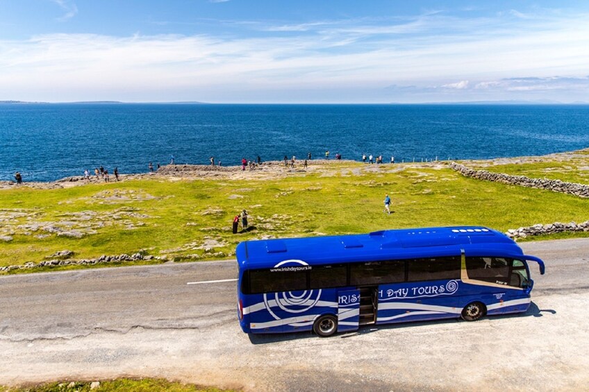 Tour bus passes the Cliffs of Moher