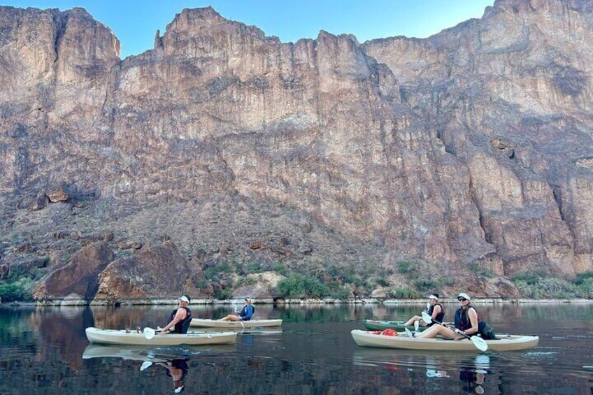 A group of kayakers head to the emerald cave.