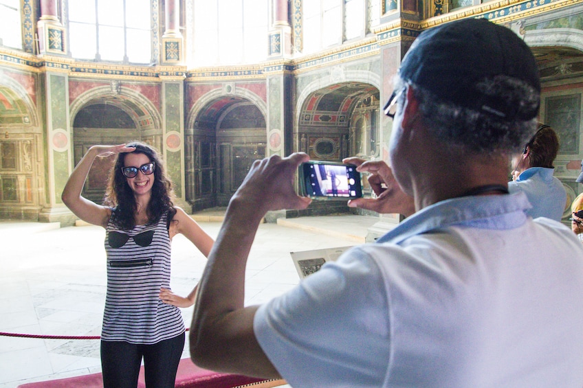 Posing for photo in castle courtyard