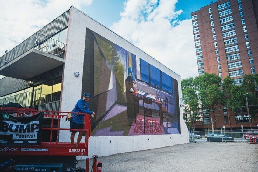 Bryan Beyung posing with his brand new 2024 mural "Little Ghost"