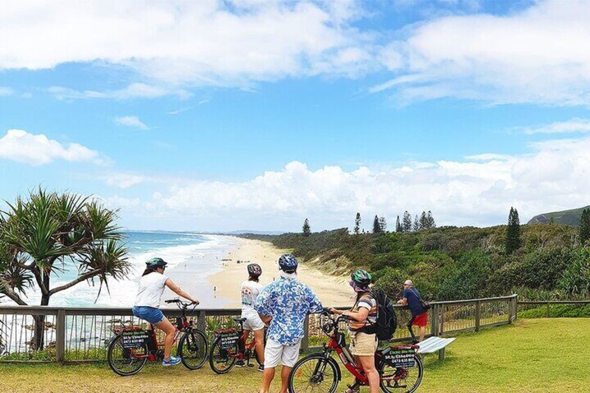 Easy Peasy Novotel North e-Bike Tour: Riders Enjoy Coastal Views from Pt Arkwright with Mt Coolum and Coral Sea Surf