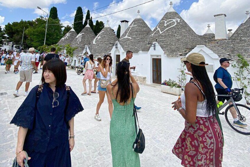 group taking photos of the trulli