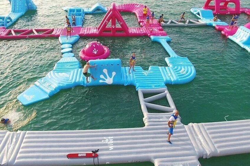 Dive into the ultimate water adventure at Aqua Fun Dubai – the world's largest inflatable water park, floating on the stunning Gulf Sea!