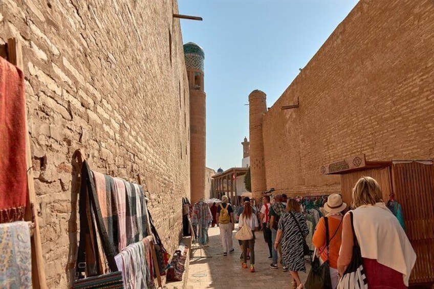 Happy tourists walk in Khiva