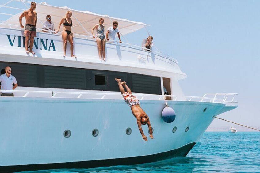 Joyful Dive From Boat