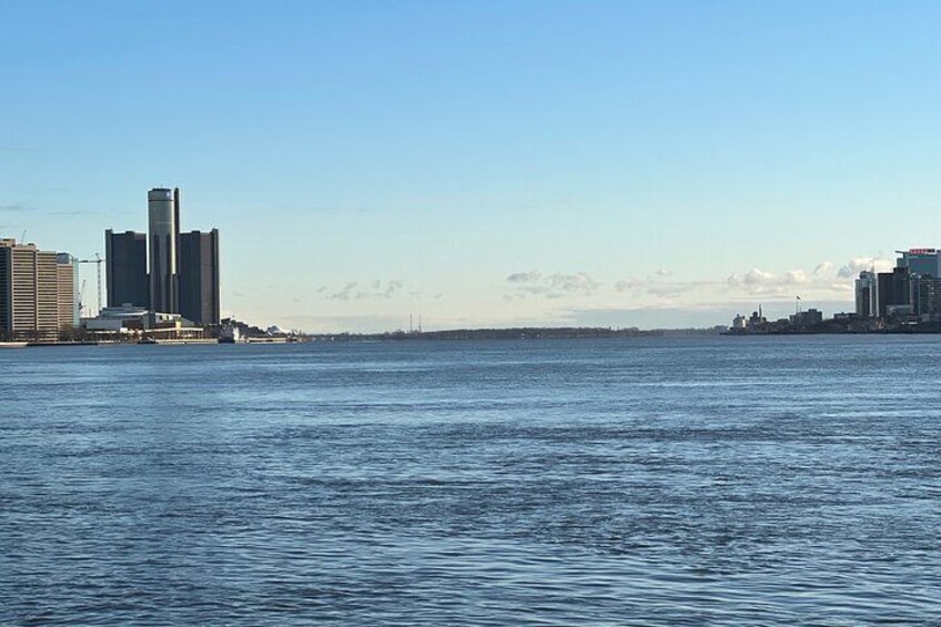 The Straits of Detroit (The Detroit River) with Belle Isle in the distance between Detroit on the left, and Windsor on the right.