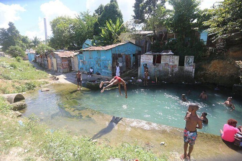 Crystal clear water cenote located in Favela Gualey