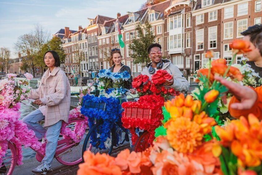 Explore Amsterdam canals on iconic Flower Bikes