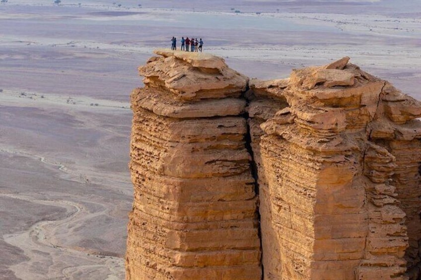 Edge of the World Tuwaiq Mountains with SUV at Sunset and Dinner