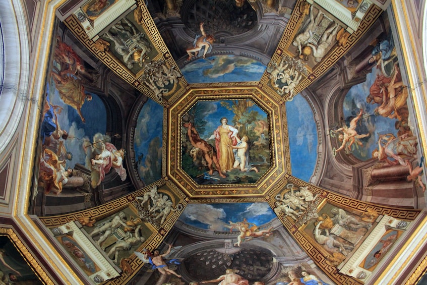 View of a ceiling inside a gallery in the Vatican Museums
