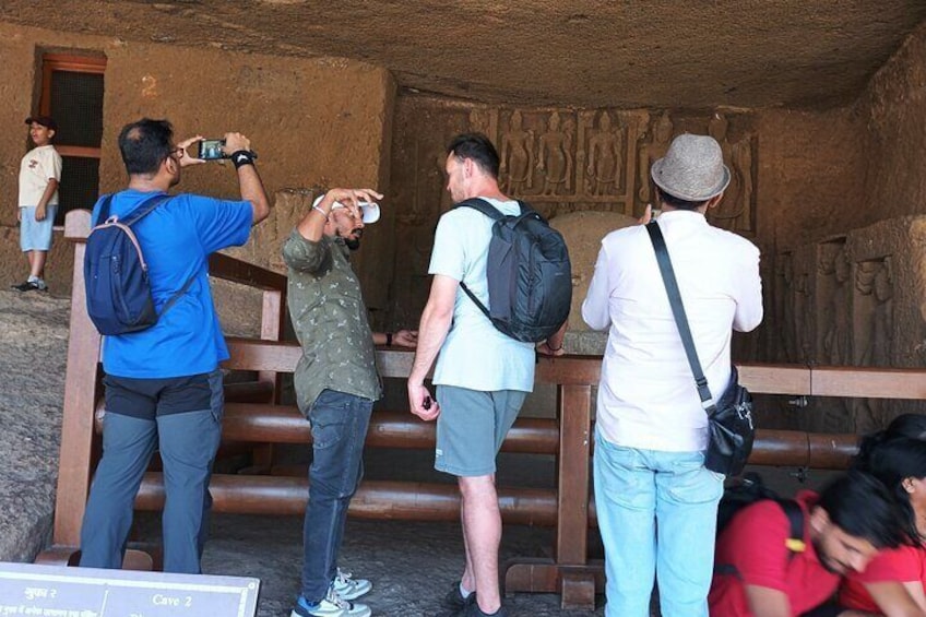 "Exploring the ancient Kanheri Caves, where history meets adventure. A journey through time with tourists marveling at the rock-cut architecture and serene surroundings."

