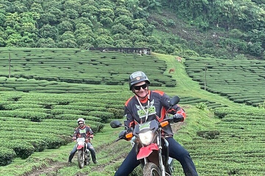the rider, filled with joy, laughs wholeheartedly while enjoying the farm