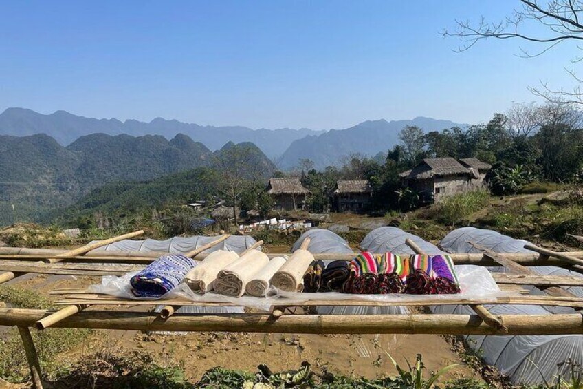 local dry their traditional dresses on a sunny day in their village, which we pass on our way