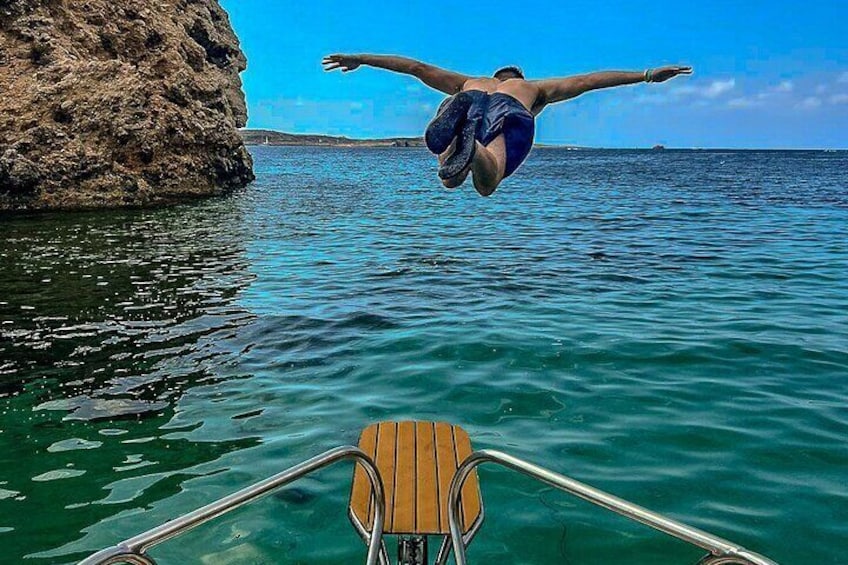 Feel the thrill of jumping off the prow of your private boat straight into the crystal-clear waters of Comino and Blue Lagoon for an unforgettable adventure.