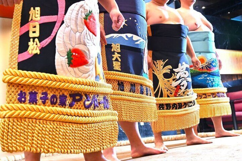 ornamental mawashi aprons (a type of beautiful loincloth worn by the wrestlers when entering the ring)