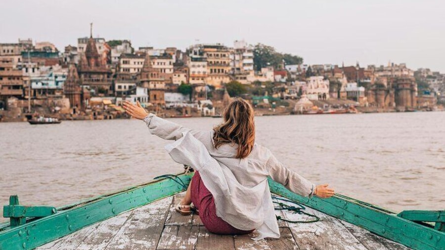 Our guest enjoying boat tour on the banks of ganges river.
