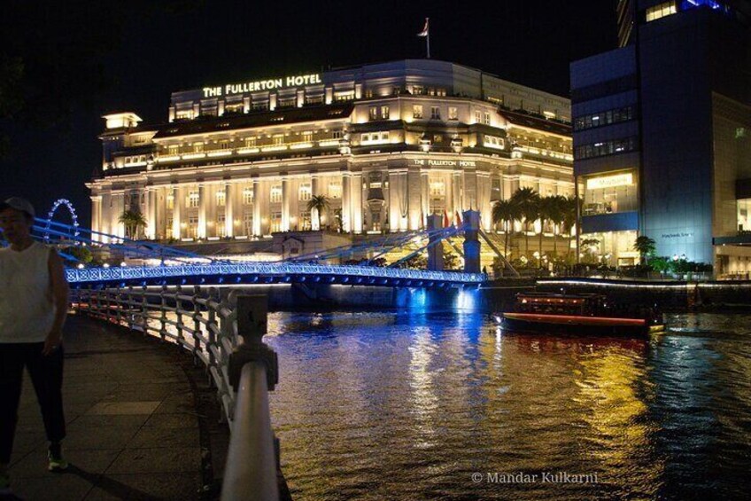 Singapore River Cruise passing The Fullerton Hotel