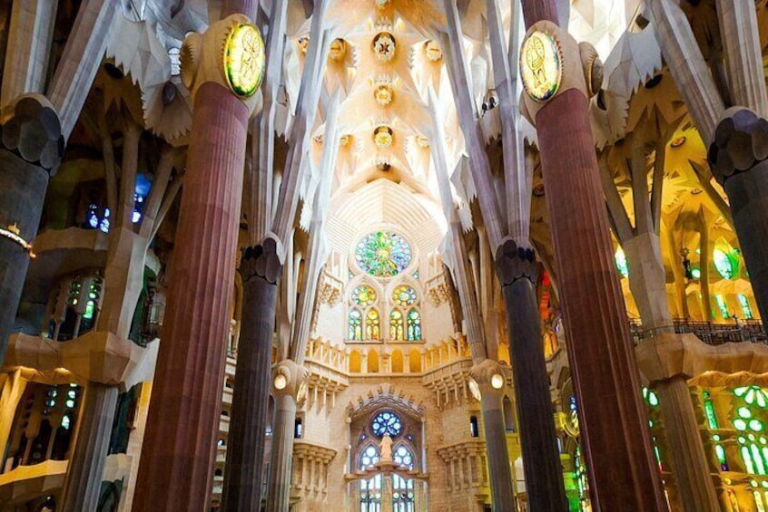Marvel at the forest-like columns and celestial ceiling of the Sagrada Família, where Antoni Gaudí’s visionary genius comes to life in an awe-inspiring symphony of light and design.