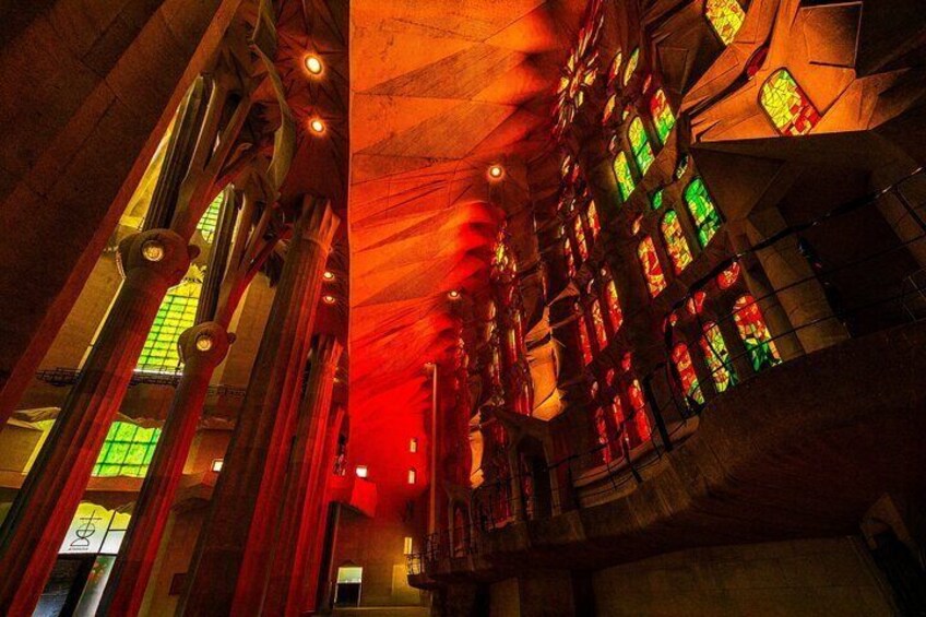 As the sun sets, the Sagrada Família transforms into a glowing sanctuary of fiery reds and golds—a mesmerizing spectacle reserved for those who linger a little longer.