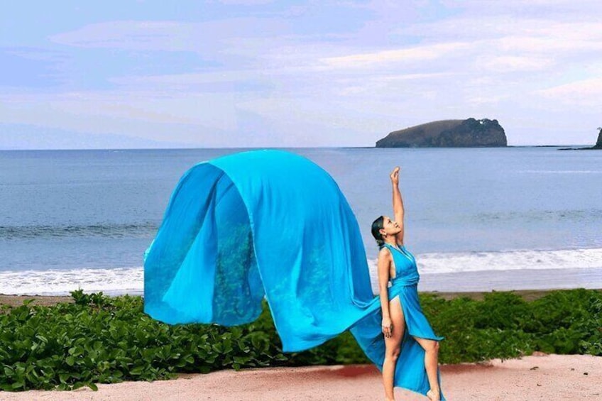 Sky Blue Bachelorette: Stunning solo shot in a sky blue flying dress, ideal for a memorable beachside bachelorette photoshoot.