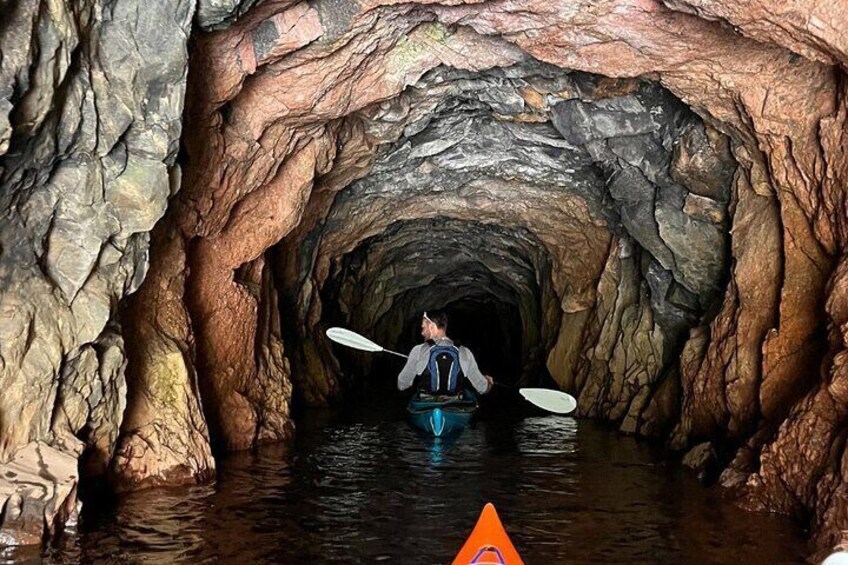 Experience a hidden cave only accessible by kayak