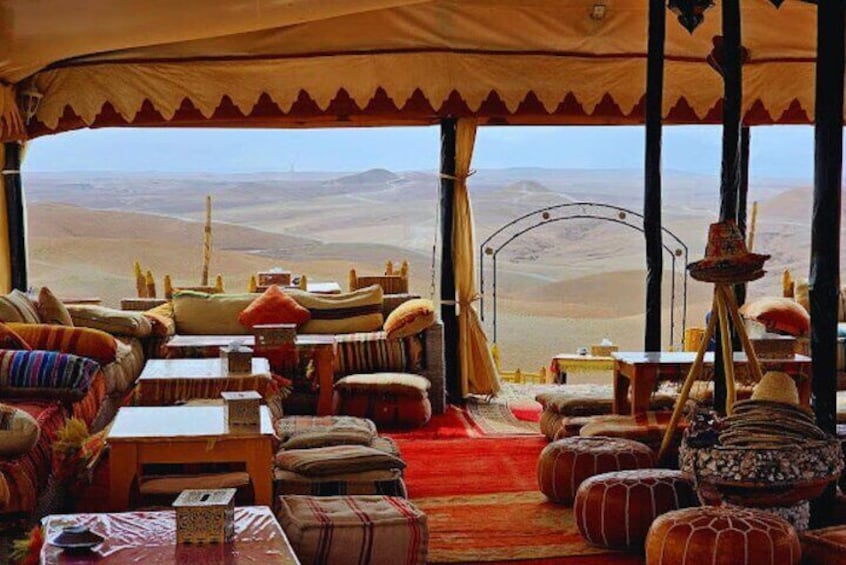 Savor authentic Moroccan cuisine at a high-end desert restaurant in Agafay, offering spectacular views and a serene ambiance under the stars.