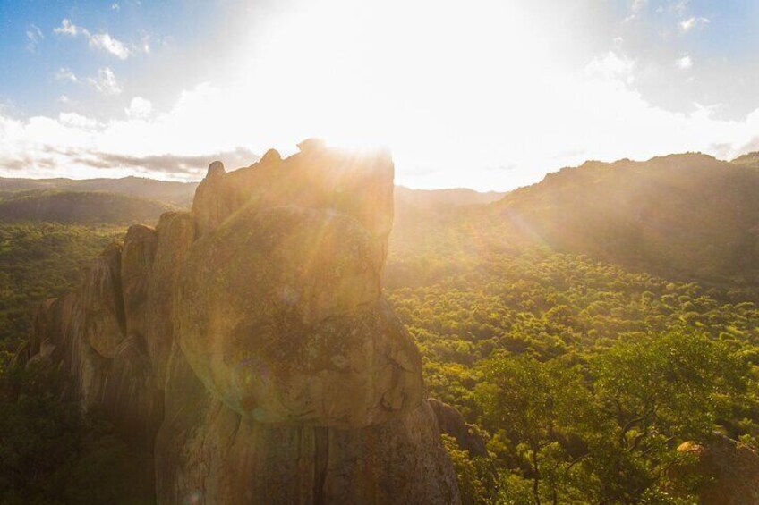 The sun's rays highlighting Matobo's dramatic granite domes and kopjes