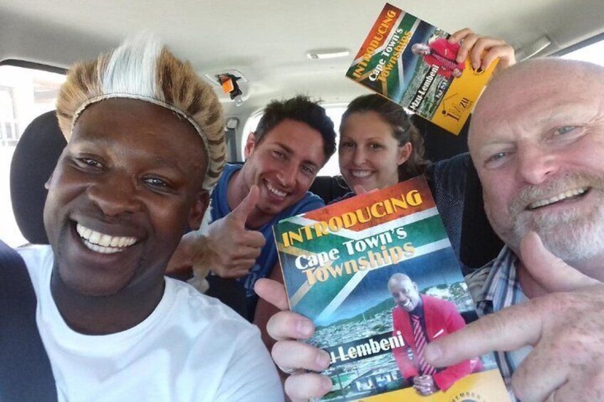 Owner of Imzu Tours, Mzu Lembeni, showcasing his book with some of our guests