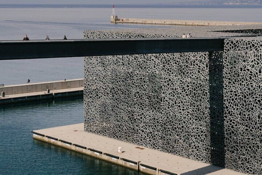 Photography of concrete mesh credited to: © Architects Rudy Ricciotti and Roland Carta / Mucem.