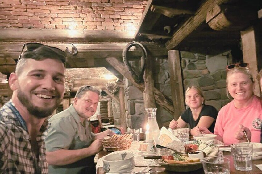 Family tasting żurek at traditional highlander restaurant