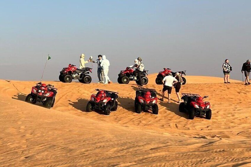 Enjoying ATV ride in red sand desert