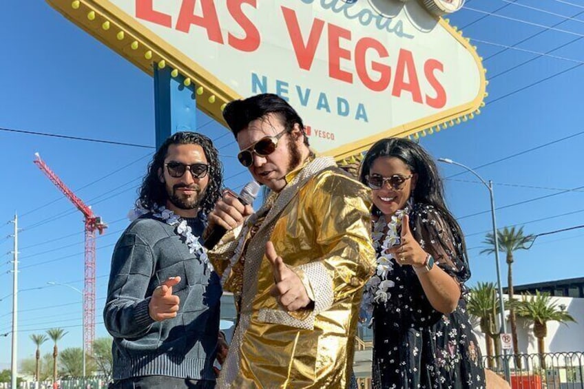 Wedding King of Las Vegas Performing a Gold Elvis Vow Renewal at the Fabulous Las Vegas Sign