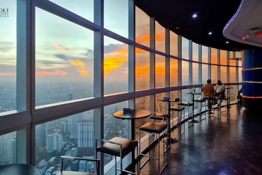 The indoor zone of Crystal Grill Restaurant offers elegant dining with panoramic city views through floor-to-ceiling windows.