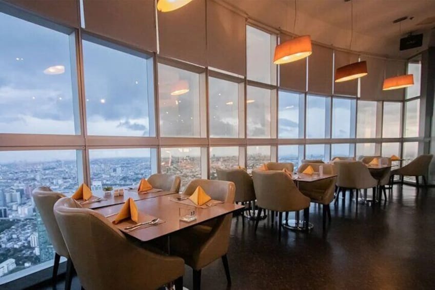 The indoor zone of Crystal Grill Restaurant offers elegant dining with panoramic city views through floor-to-ceiling windows.