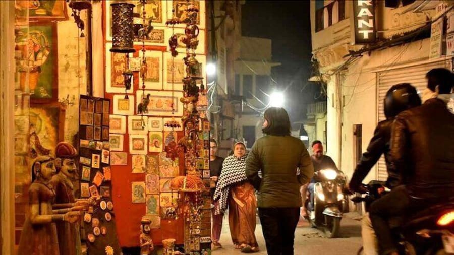 Udaipur's streets come alive under the shimmering night sky.