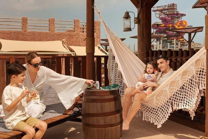 A perfect family retreat at Meryal Waterpark, where luxury cabanas offer relaxation just steps away from thrilling slides.