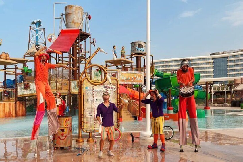 Vibrant street performers light up Meryal Waterpark with dazzling juggling, lively music, and impressive stilt walking.