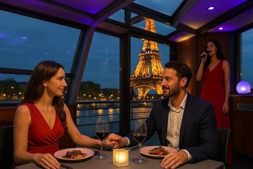 Romantic dinner with Eiffel Tower views on a Seine River cruise — a magical night in Paris with live French music and a 3 course gourmet meal.