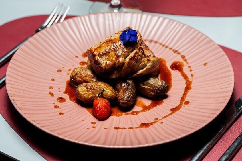 Tender veal with baby potatoes and red wine sauce.