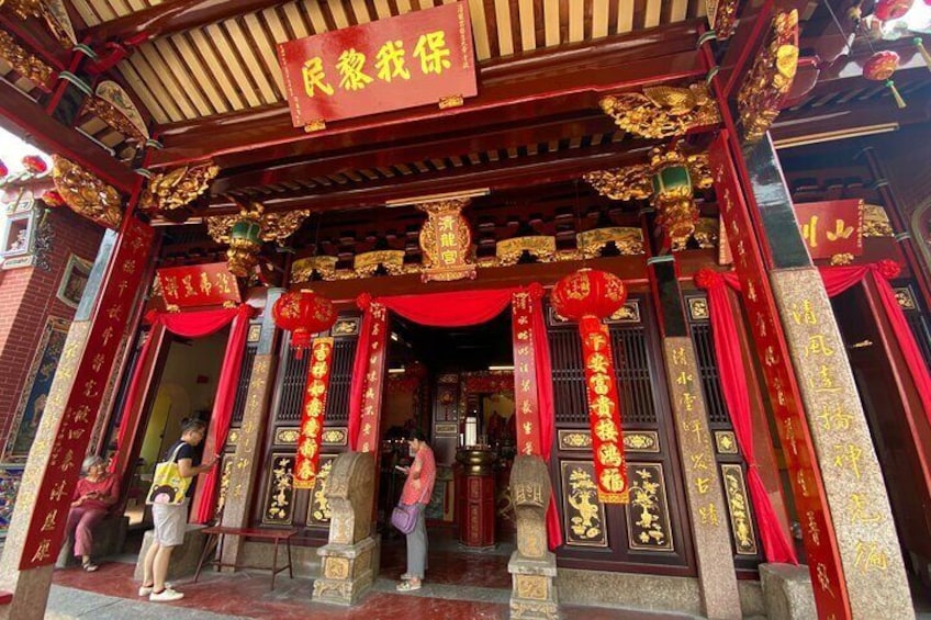 Enter the temple to seek blessings from the deities.