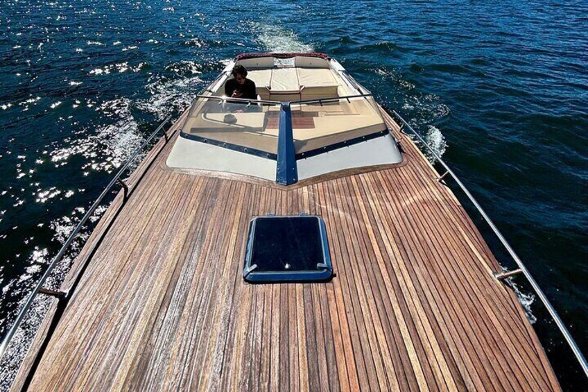 The carefully crafted teak surfaces and sleek lines evoke the unique style of the Dolce Vita era