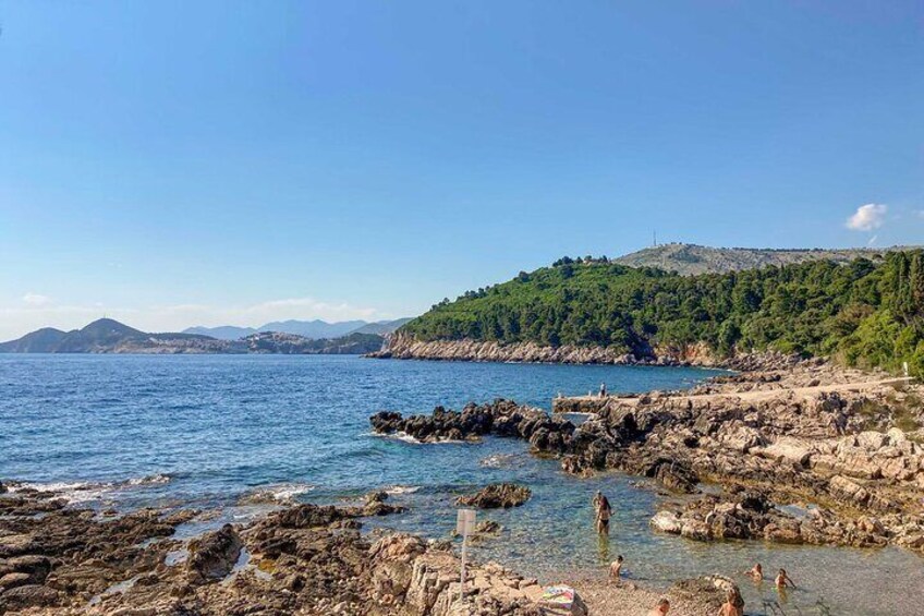 “Take a break and dive into the clear blue waters at our Lokrum swimming stop.”