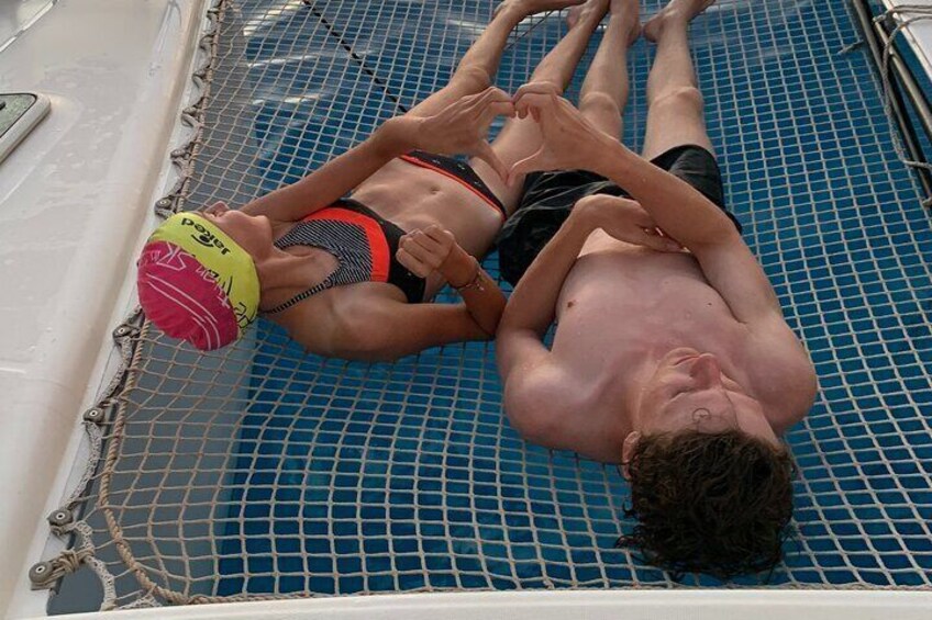 Exclusive catamaran sailing 3 hours dolphin drinks swim stop