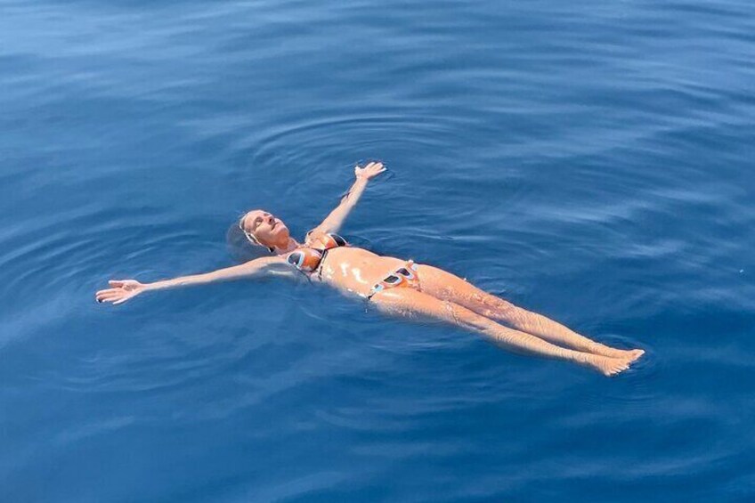 Exclusive catamaran sailing 3 hours dolphin drinks swim stop