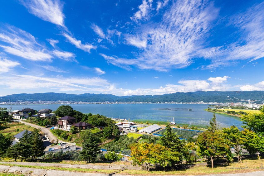 Gorgeous blue skies above Lake Suwa in Japan
