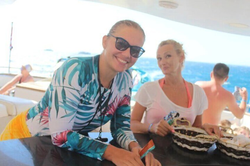 Two Women Capturing a Moment on a Boat En Route to Dolphin House in Hurghada