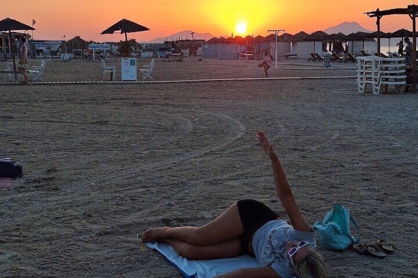 An amazing lady doing sunset Pilates in summer in Kos