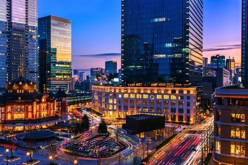 Tokyo Station's night view blends modern skyscrapers with traditional architecture, creating a stunning contrast
