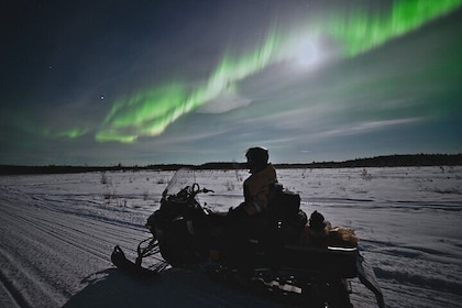 Arctic Aurora Chase by Snowmobile